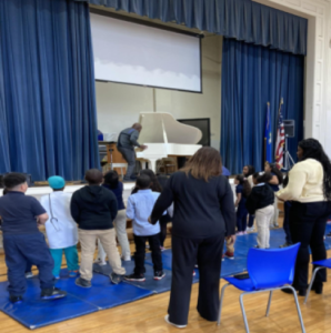 SHU Gospel Choir Director, Michael Whitney Brown, had everyone on their feet.