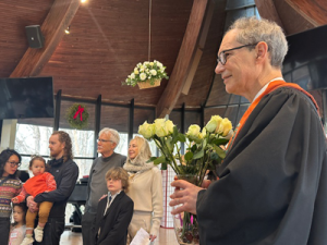 Child Dedication, December 15, 2024: Rev. Alan and roses